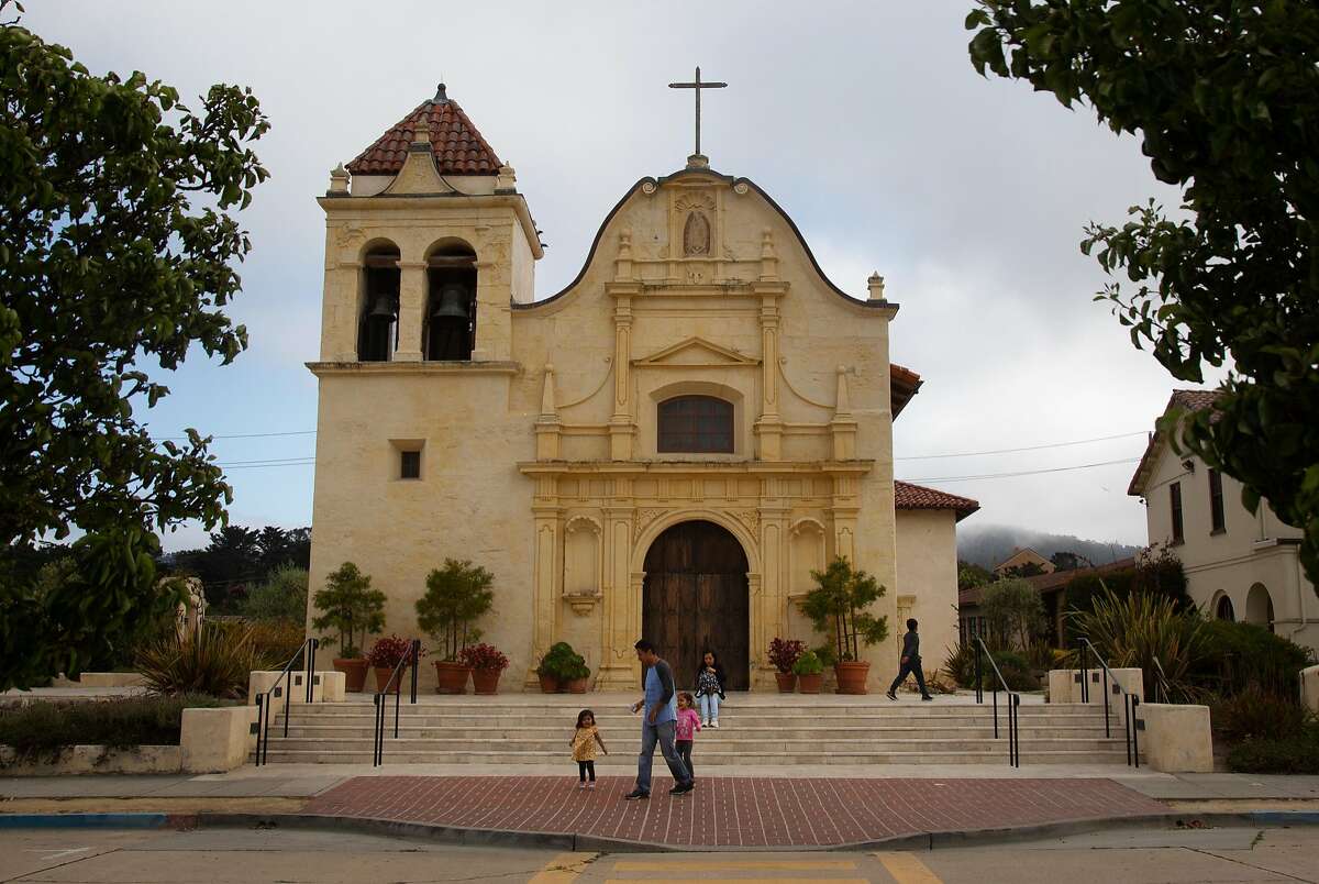 Tourists visit San Carlos Cathedral on Monday, 7/30, 2018 in Monterey, California. Local historian Tim Thomas recommends the cathedral to visitors who are interested in Monterey's history. The cathedral is the oldest continuously operating parish and the oldest stone building in California. It was built in 1794 making it the oldest (and smallest) serving cathedral along with St. Louis Cathedral in New Orleans, Louisiana. It is the only existing presidio chapel in California and the only existing building in the original Monterey Presidio.