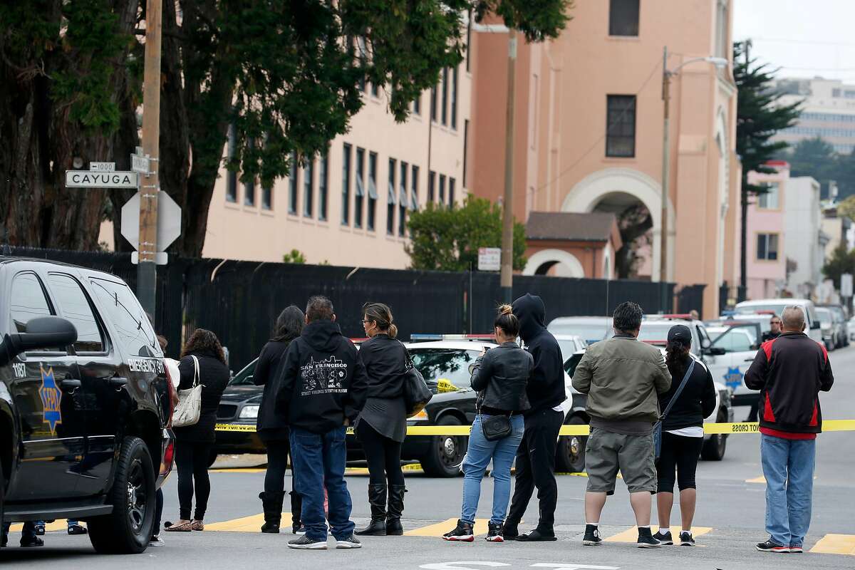 Concerned people gather outside of Balboa High School after hearing reports of an active shooter on campus in San Francisco, Calif. on Thursday, Aug. 30, 2018.