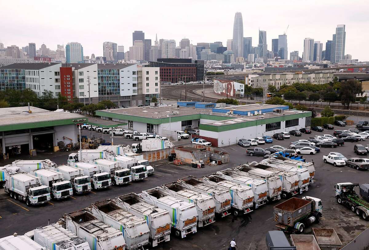 Recycling collection trucks are parked in a Recology maintenance yard on Seventh Street in San Francisco, Calif. on Thursday, Aug. 30, 2018 which it hopes to shut down and develop housing in its place.