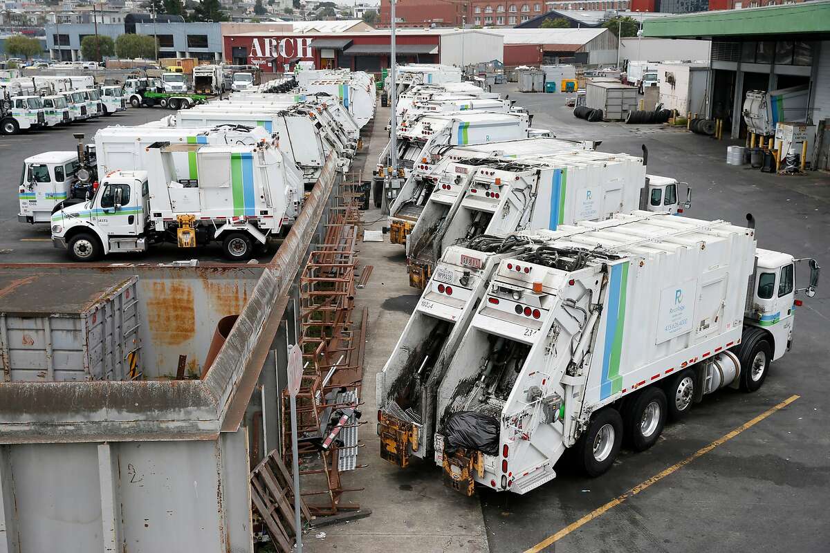 Recycling collection trucks are parked in a Recology maintenance yard on Seventh Street in San Francisco, Calif. on Thursday, Aug. 30, 2018 which it hopes to shut down and develop housing in its place.
