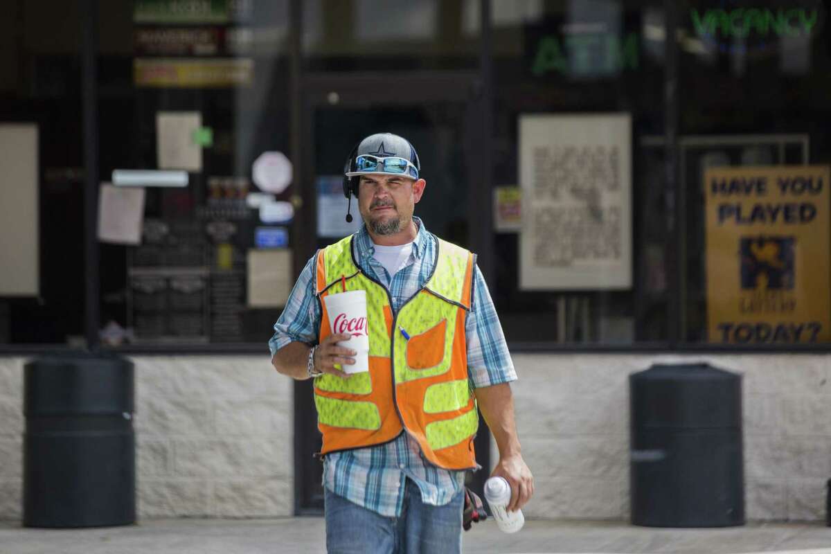 Justin Grande, 40, from Atascocita walks back to his truck after making purchases at the Port Auto Truck Stop convenience store, Monday, Aug. 27, 2018, in La Porte. Grande is a local trucker and a former mechanic. He has kept himself from long haul drives to be able to be present for him family. Grande is a father of four children.