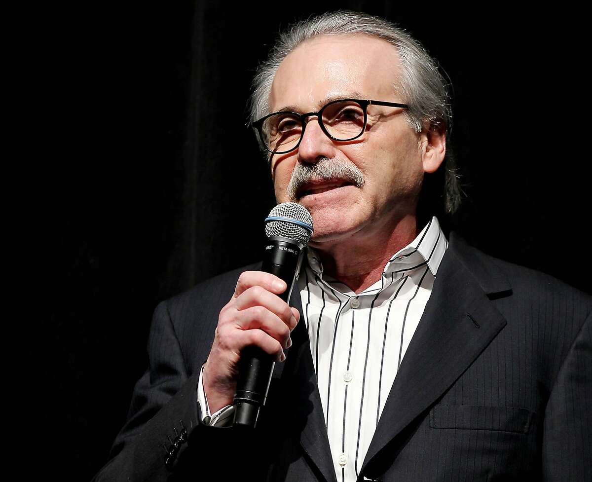 FILE - In this Jan. 31, 2014 photo, David Pecker, Chairman and CEO of American Media, addresses those attending the Shape & Men's Fitness Super Bowl Party in New York. The National Enquirer kept a safe containing documents on hush-money payments and other damaging stories it killed as part of its cozy relationship with Donald Trump leading up to 2016 presidential election, people familiar with the arrangement told The Associated Press. The detail comes as several media outlets reported Thursday, Aug. 23, 2018 that federal prosecutors have granted immunity to Pecker, potentially laying bare his efforts to protect his longtime friend Trump. (Marion Curtis via AP, File)