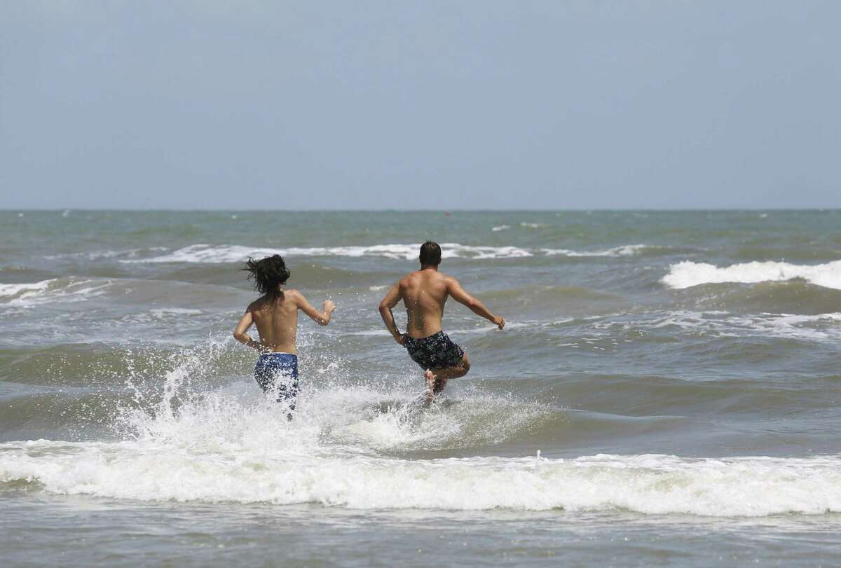 People enjoy a summer day in Galveston in this June 2018 file photo. A new report issued Thursday, Aug. 30, 2018, by Environment Texas says Galveston’s water contains bacteria that could cause illnesses.