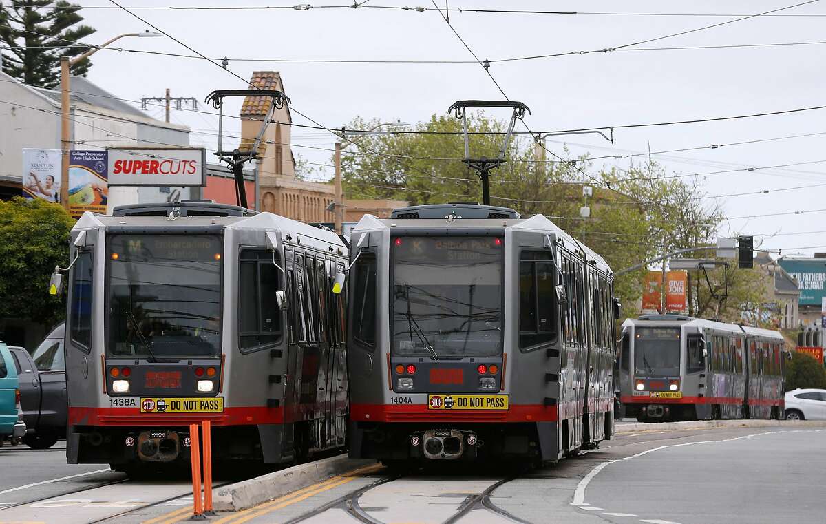 Muni Metro streetcars travel up and down West Portal Avenue in San Francisco, Calif. on Thursday, April 5, 2018. Supervisor and mayoral candidate Jane Kim is opposing SB827, authored by state Sen. Scott Wiener, which would require cities to allow four- to eight-story apartment and condo buildings in residential areas if they are within a half mile of major transit hubs and would also mandate that cities allow such buildings within a quarter mile of highly used bus and light-rail stops.