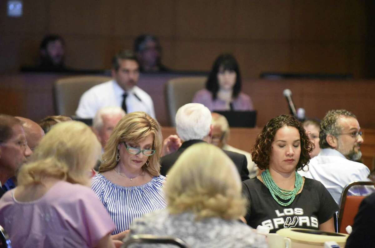 Alamo Citizen Advisory Committee members vote on a plan to remake Alamo Plaza. The meeting was held in the City Council chambers on Aug. 30, 2018.