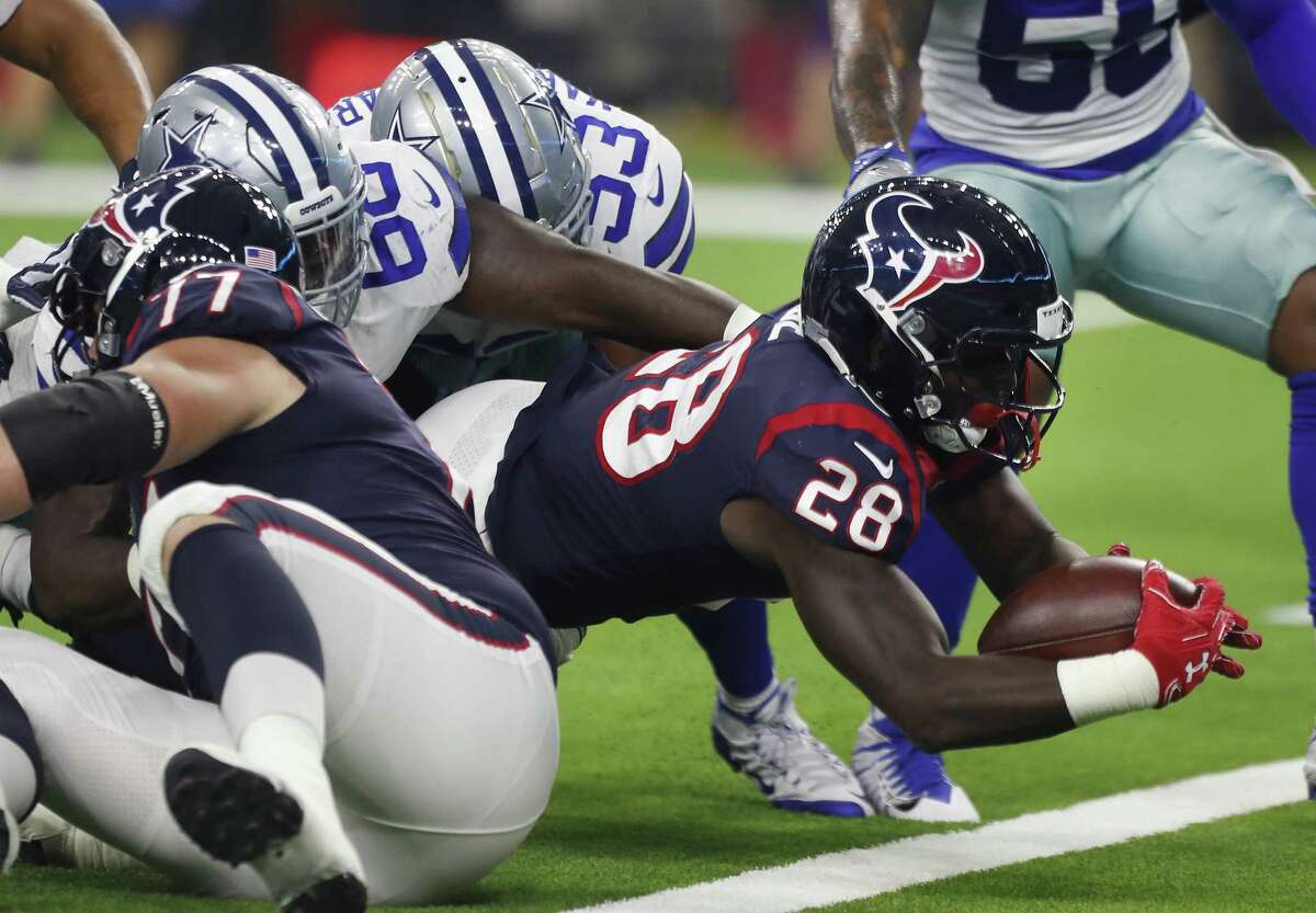 Texans running back Alfred Blue dives in for a 4-yard touchdown during the first quarter of Houston’s 14-6 win in the preseason finale.