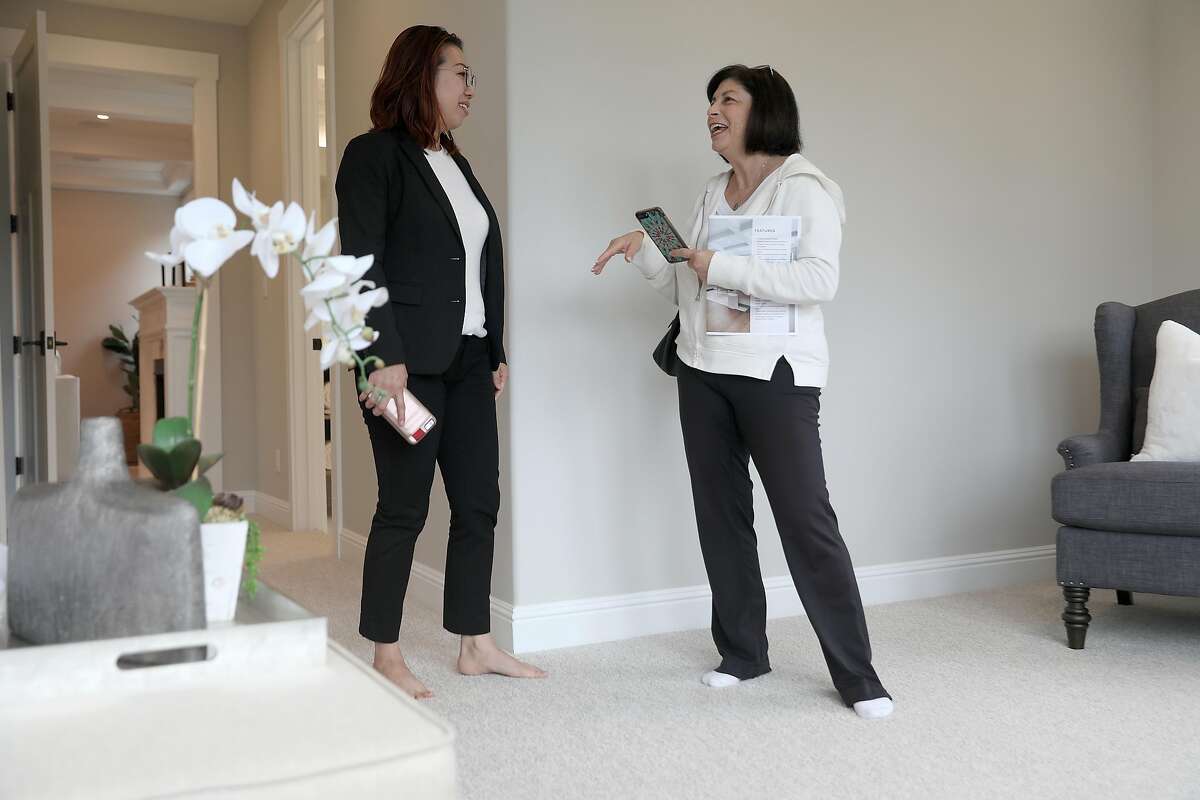 Realtor Denise Liew (left) speaks with visitor Joy Posnick (right) from Belmont doing renovation on her property and wanting to view 2133 De Anza Blvd., a new property listed for sale at $2.995,000 dollars, seen on Tuesday, Aug. 21, 2018 in San Mateo, Calif. The home is 4268 sq. ft. and is a 5 bedroom and 6.0 bath property. They are in one of the bedrooms which is on the main floor.