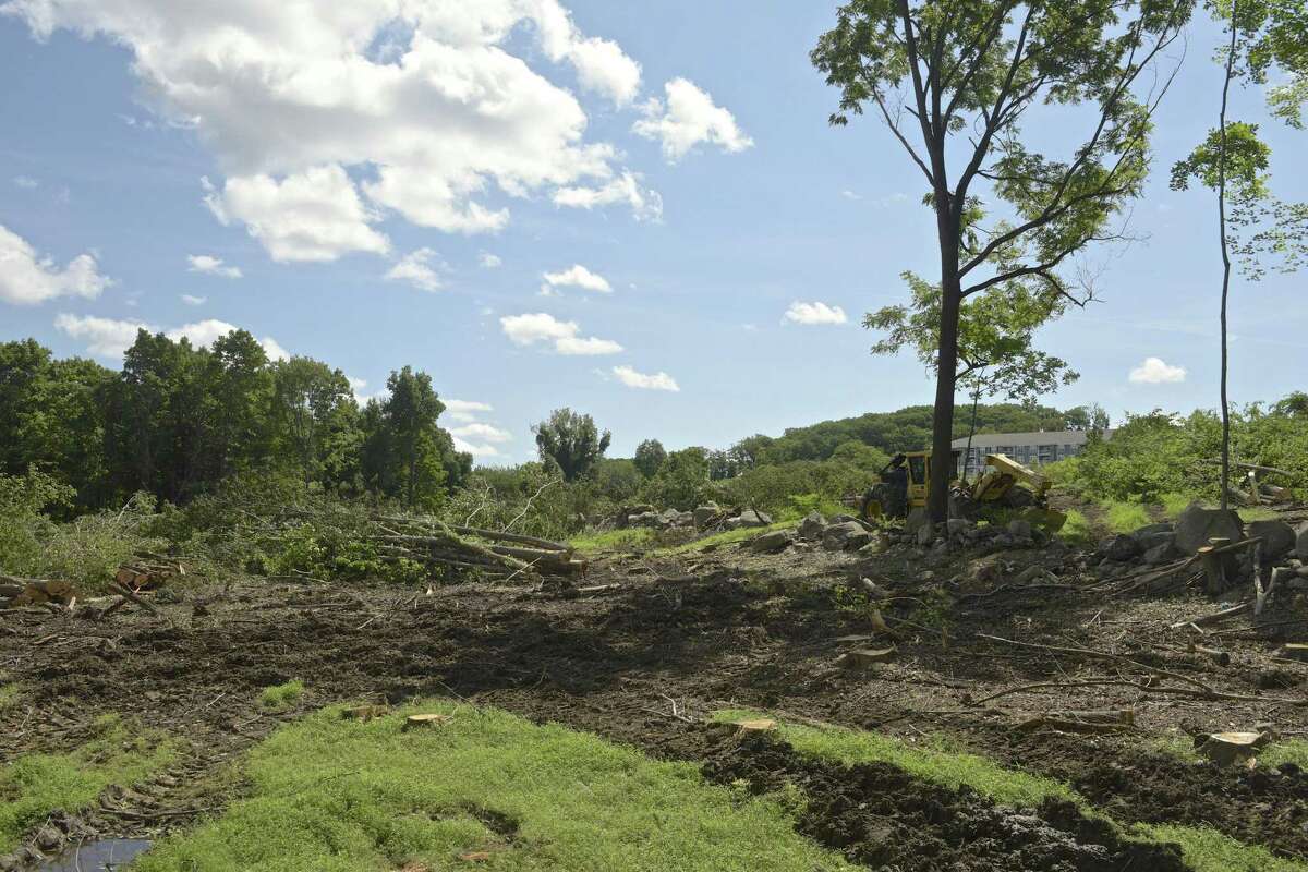 Toll Brothers has cleared trees to make way for a new housing development called Woodlands that will include 170 town homes. Thursday, August 30, 2018, in Danbury, Conn.