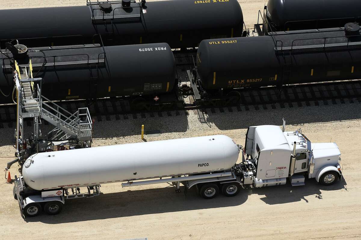 Crude oil is unloaded from tanker truck into railroad tankers at the Gardendale Railroad Inc. switching yard near Cotulla, Texas, in 2012.