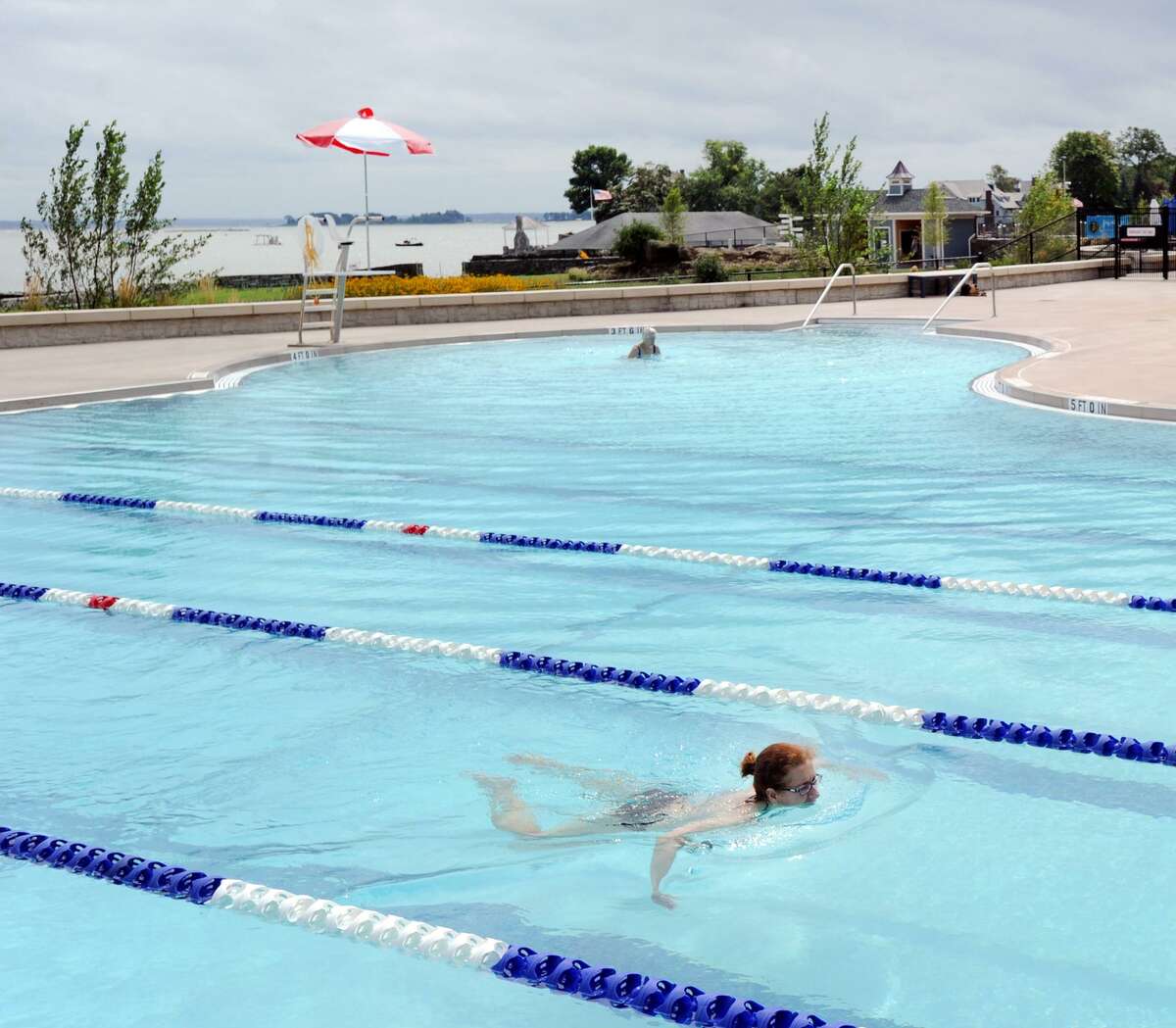 On one of the cooler days of the month, a woman, lower right, who gave her name as Laura, had the swimming lanes to herself in the Byram Park Pool in Greenwich, Conn., Friday, Aug. 31, 2018. Laura said about the pool "me and my family have used it a few times and it's great, really nice."