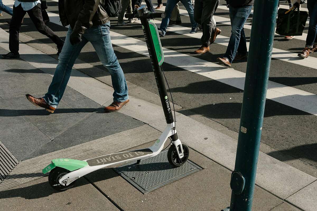 FILE -- A scooter on the sidewalk in downtown San Francisco, April 16, 2018. Doctors and public health workers in San Francisco are preparing to track injuries from electric scooters and the other transportation services blossoming in the city. (Jason Henry/The New York Times)