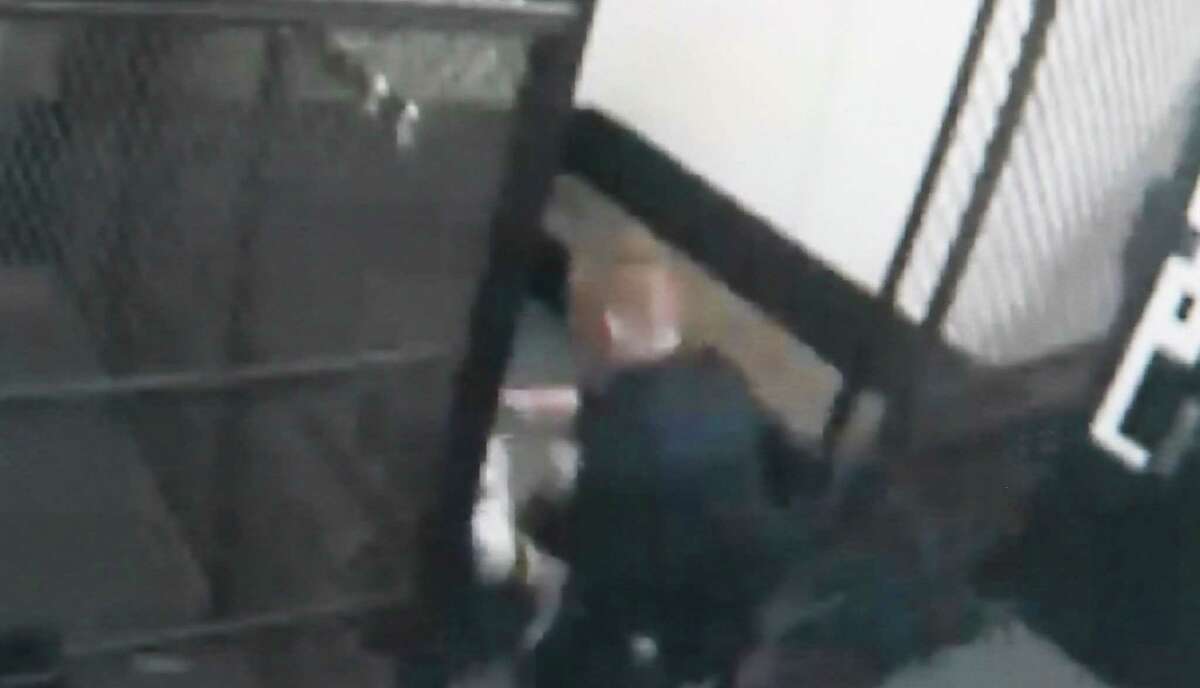 Video screengrab from the Schenectady Police Station showing a woman being taken into a holding cell by police officers. The city paid her $250,000 for injuries after she claimed a pair of city police officers body-slammed her during her arrest, punched her in the face and threw her into a wall at police headquarters, rendering her unconscious.