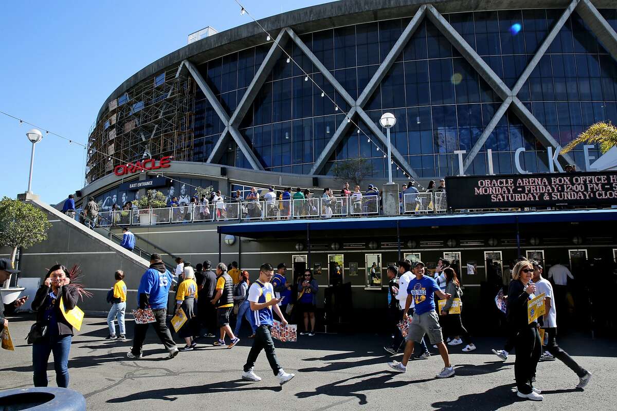 Fans enter Oracle Arena for a Golden State Warriors watch party, Friday, June 8, 2018, in Oakland, Calif. Visitors watched on the jumbotron Game 4 of the NBA Finals between the Warriors and Cleveland Cavaliers.