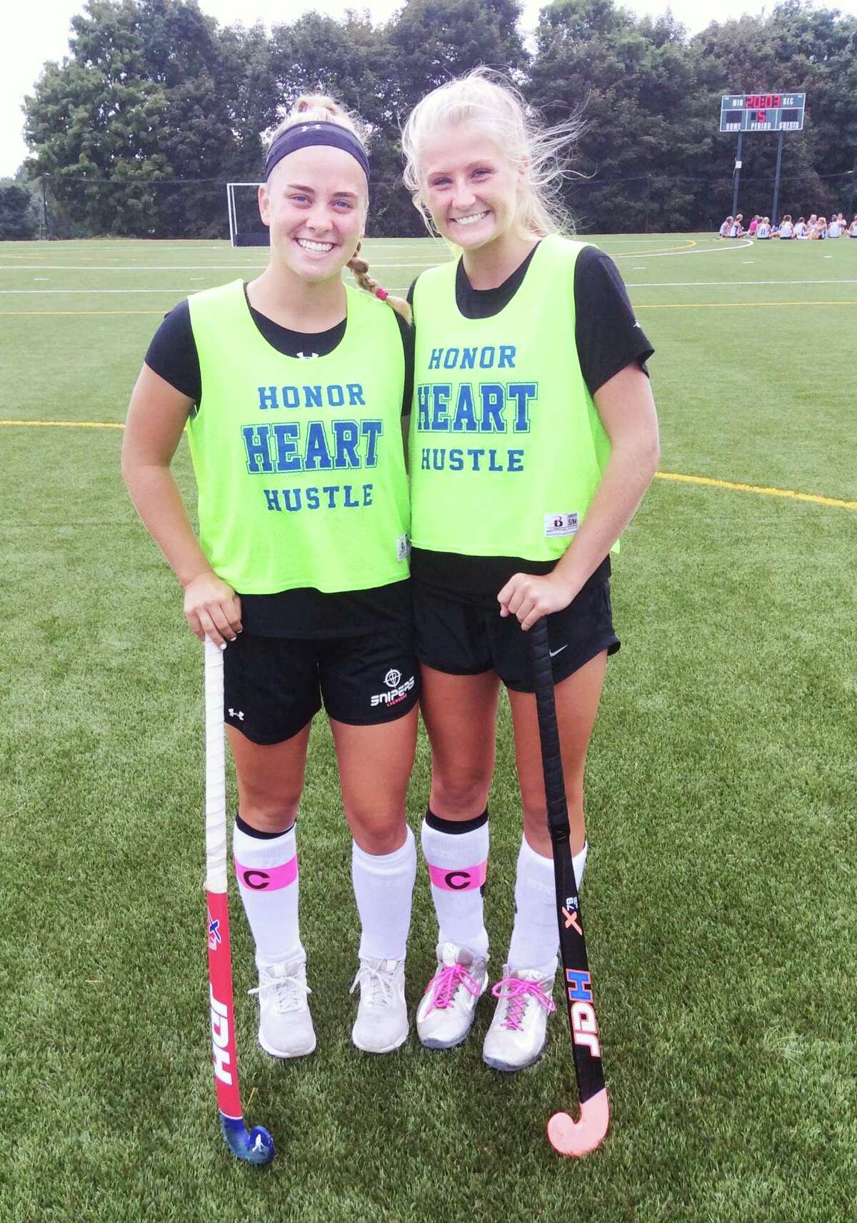 Ryan Smith, left, and Hilary Hoover are senior captains on the Sacred Heart Greenwich field hockey team.