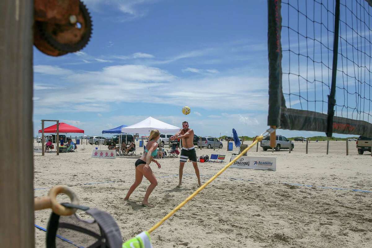 Beachgoers spike the summer with sand volleyball tournament in Galveston