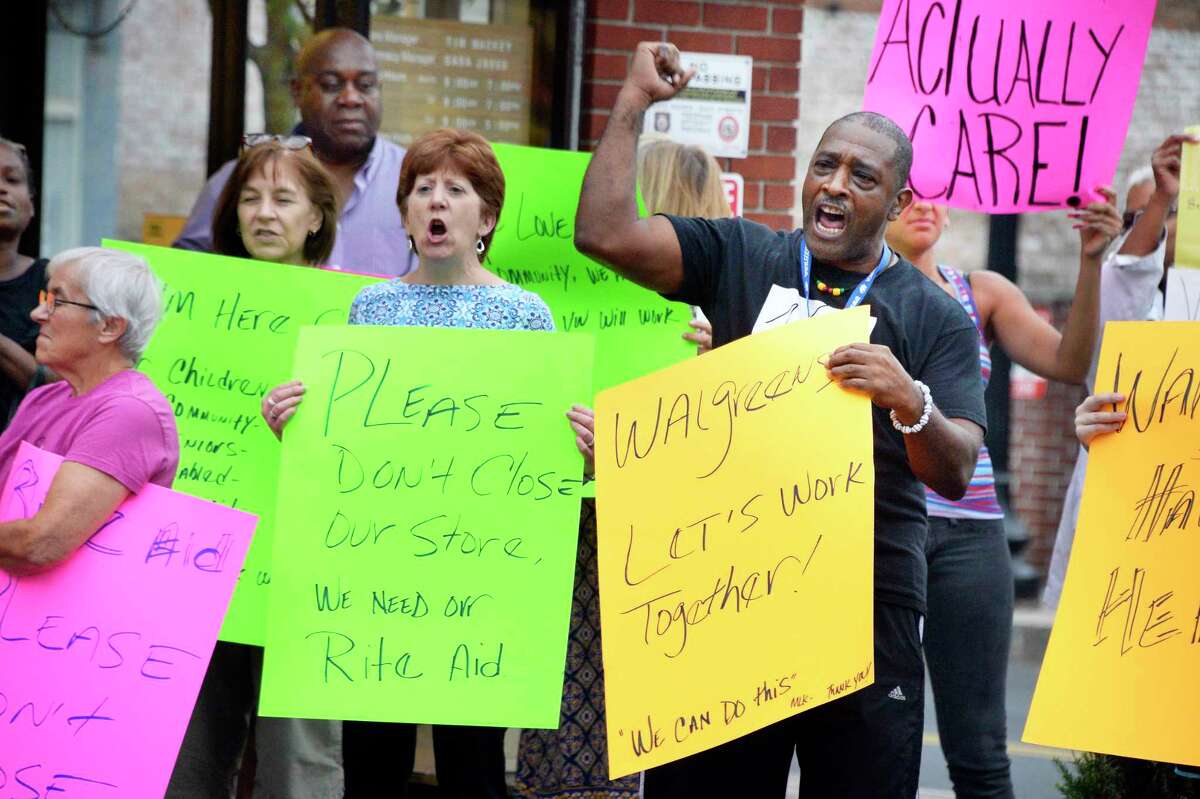Mayor Kathy Sheehan, center, joins Willie White of AVillage local residents protesting the planned closure of the Rite Aid in the South End of Albany Friday August 31, 2018 in Albany, NY. Rite Aid was recently taken over by Walgreens, and the decision was made following the merger. (John Carl D'Annibale/Times Union)