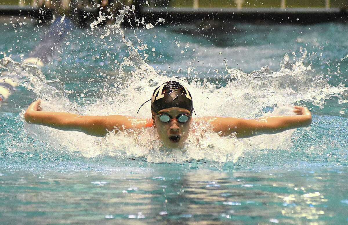 Norwalk-McMahon’s Ashley Calderon competes in the butterfly leg of the 200 medley relay during last season’s State Open girls swimming championship meet at Yale University. Greenwich won the state open title for the second straight season.