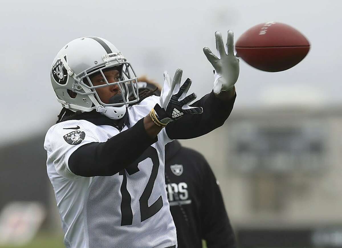 Oakland Raiders' Martavis Bryant catches a pass during NFL football practice on Tuesday, May 22, 2018, at the team's training facility in Alameda, Calif. (AP Photo/Ben Margot)