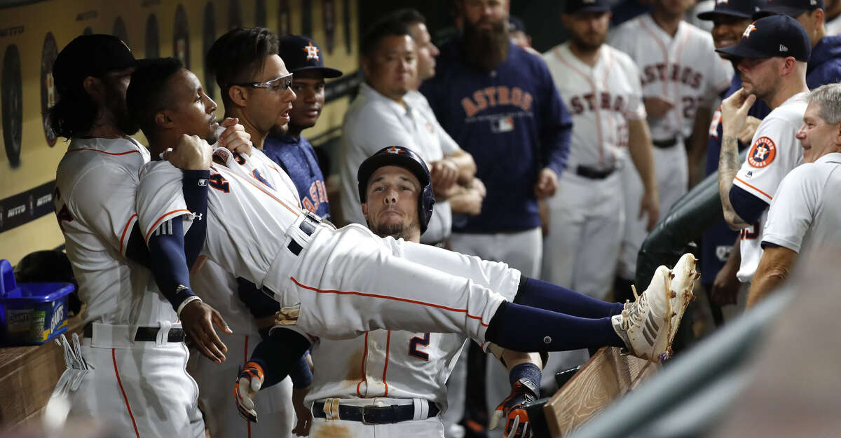 Houston Astros Alex Bregman (2) celebrates his home run with Tony Kemp and Jake Marisnick during the seventh inning of an MLB baseball game at Minute Maid Park, Sunday, September 2, 2018, in Houston.