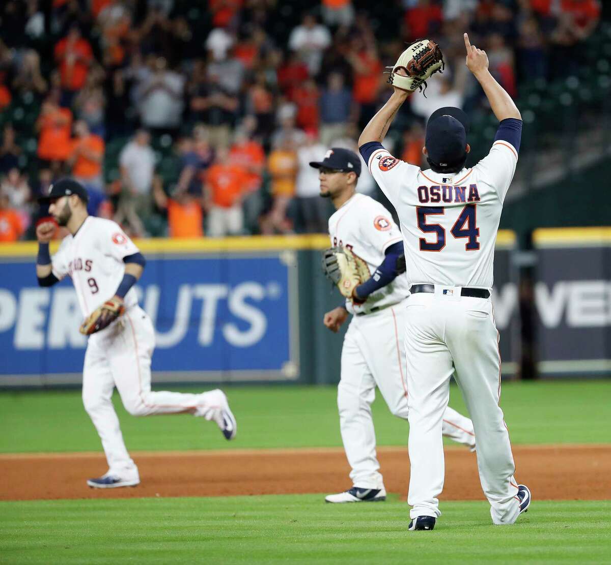 Houston Astros relief pitcher Roberto Osuna (54) celebrates the Astros 4-2 win over the Los Angeles Angels after the ninth inning of an MLB baseball game at Minute Maid Park, Sunday, September 2, 2018, in Houston.