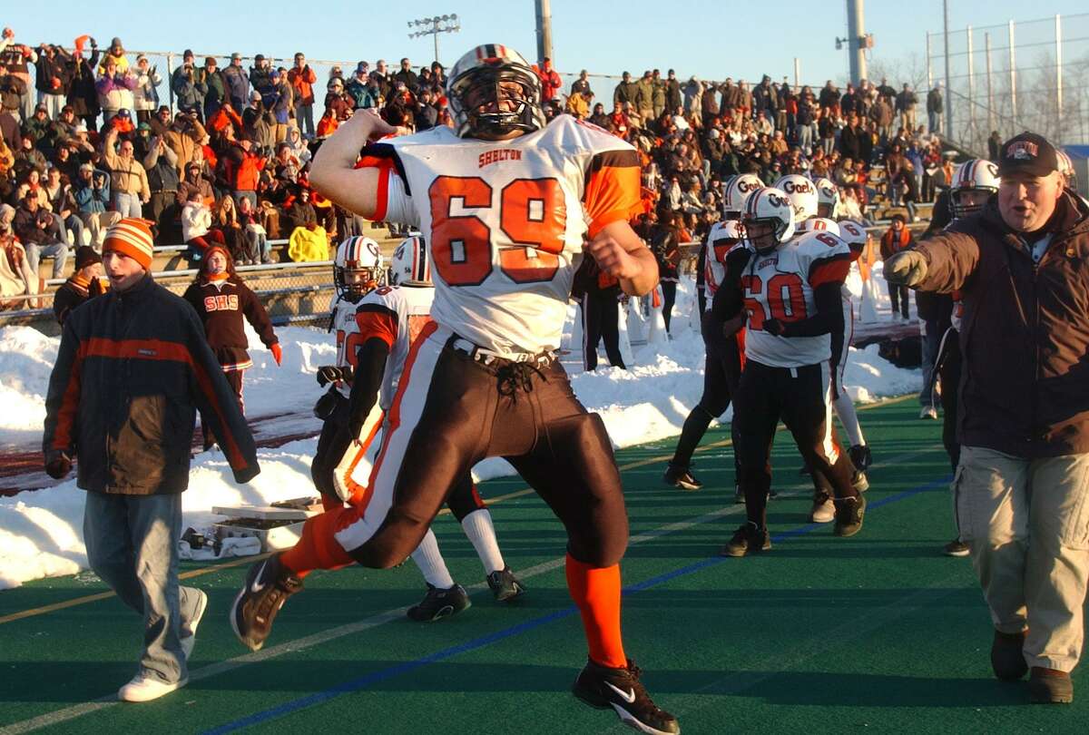 SP 12/8/03 Volpe 0098c: Shelton's Michael Alcutt celebrates the Gaels' second TD Monday evening in the State Class L High School football championship vs. Staples High in West Haven.