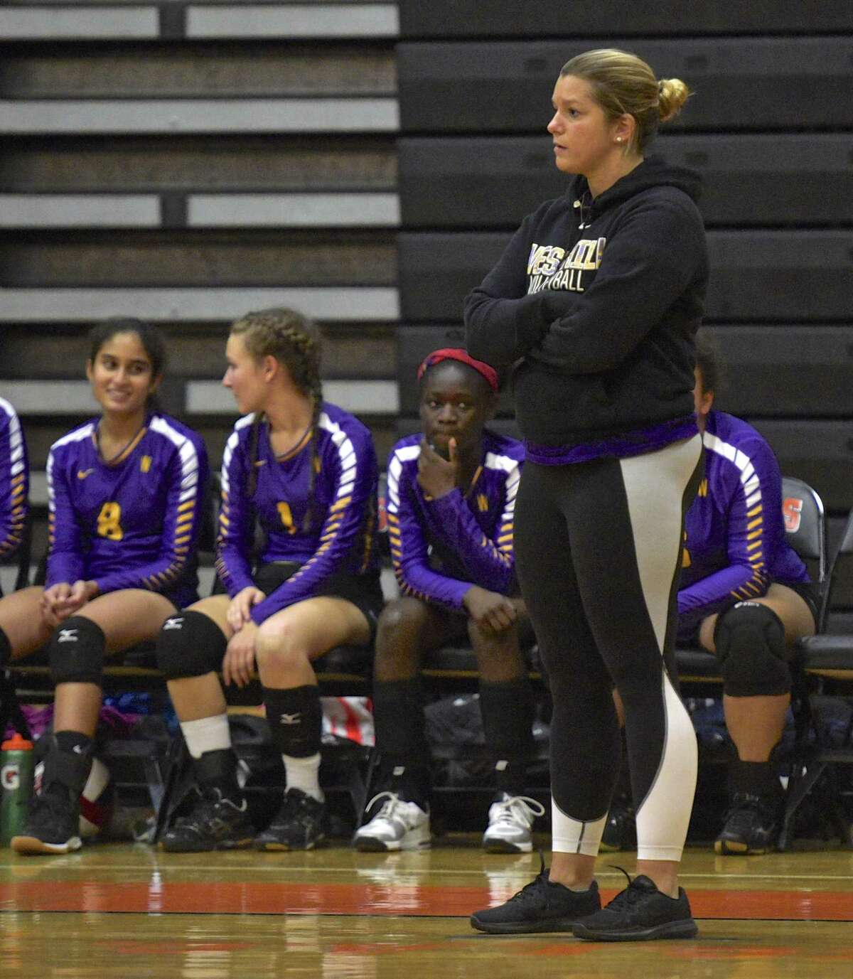 Westhill head coach Marianna Capomolla watches her team in the girls volleyball game between Westhill and Ridgefield high schools on Oct. 25, 2017, at Ridgefield High School, in Ridgefield, Conn.