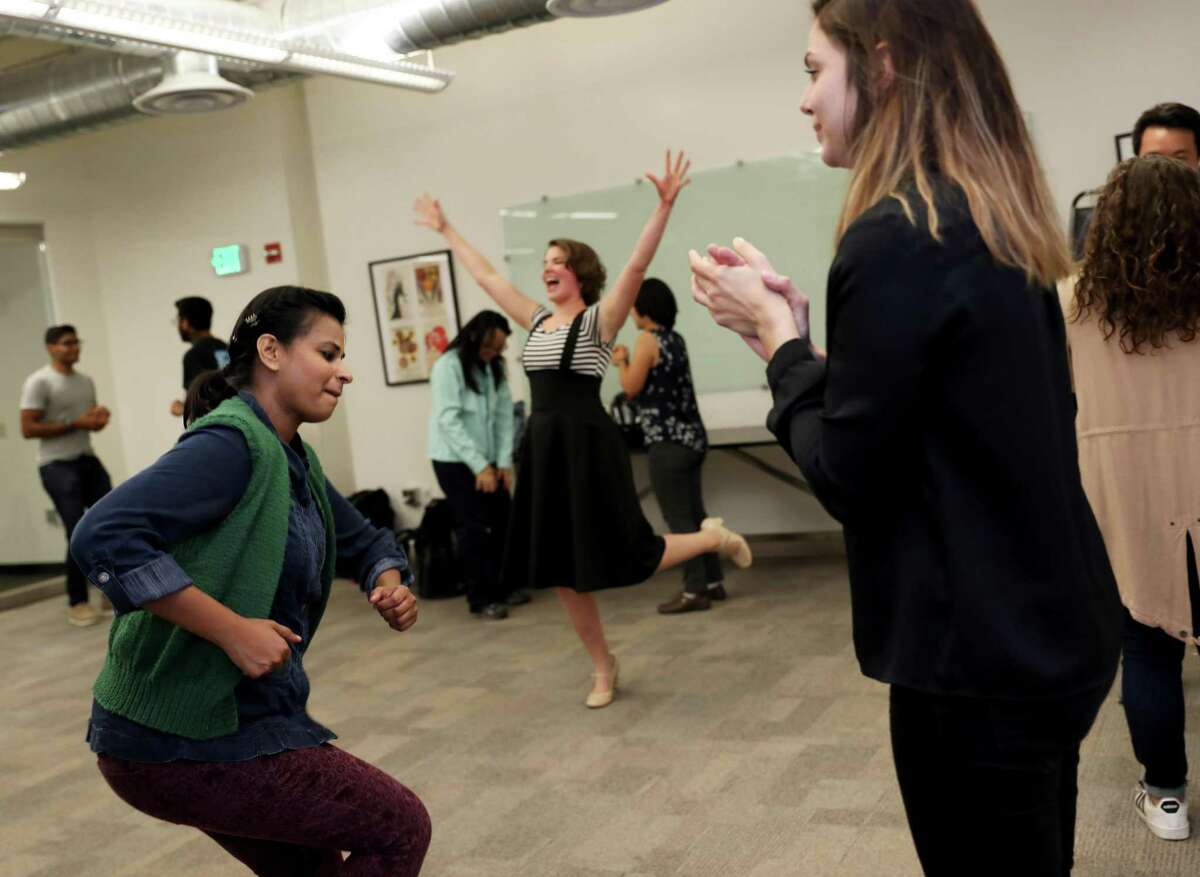 Radhika Rao (left), a local theater teacher and actor, and Rebekah Dial, perform an exercise at a drop-in improv class hosted by Nicole Odell in Intersection for the Arts’ Conference Room in San Francisco.