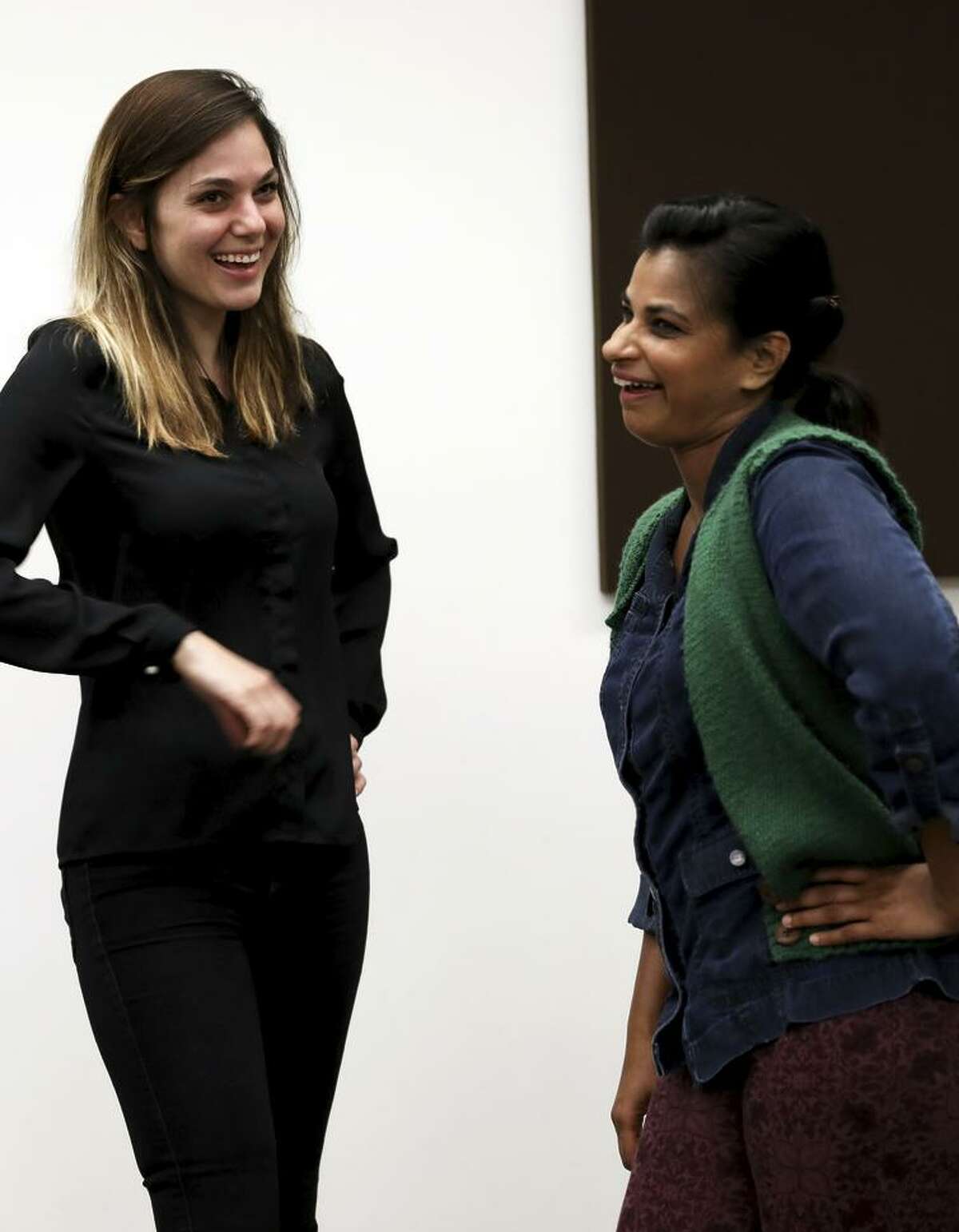 Rebekah Dial (left) and Radhika Rao perform an improv class exercise at Intersection for the Arts.