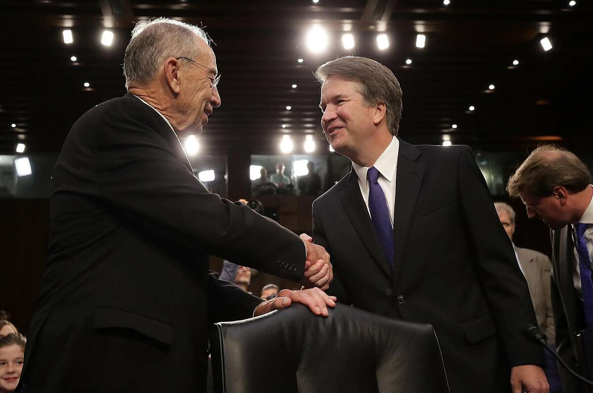 WASHINGTON, DC - SEPTEMBER 04: Supreme Court nominee Judge Brett Kavanaugh (R) is greeted by committee chairman Sen. Chuck Grassley (R-IA) as Kavanaugh arrives for testimony before the Senate Judiciary Committee during his Supreme Court confirmation hearing in the Hart Senate Office Building on Capitol Hill September 4, 2018 in Washington, DC. Kavanaugh was nominated by President Donald Trump to fill the vacancy on the court left by retiring Associate Justice Anthony Kennedy. (Photo by Drew Angerer/Getty Images)
