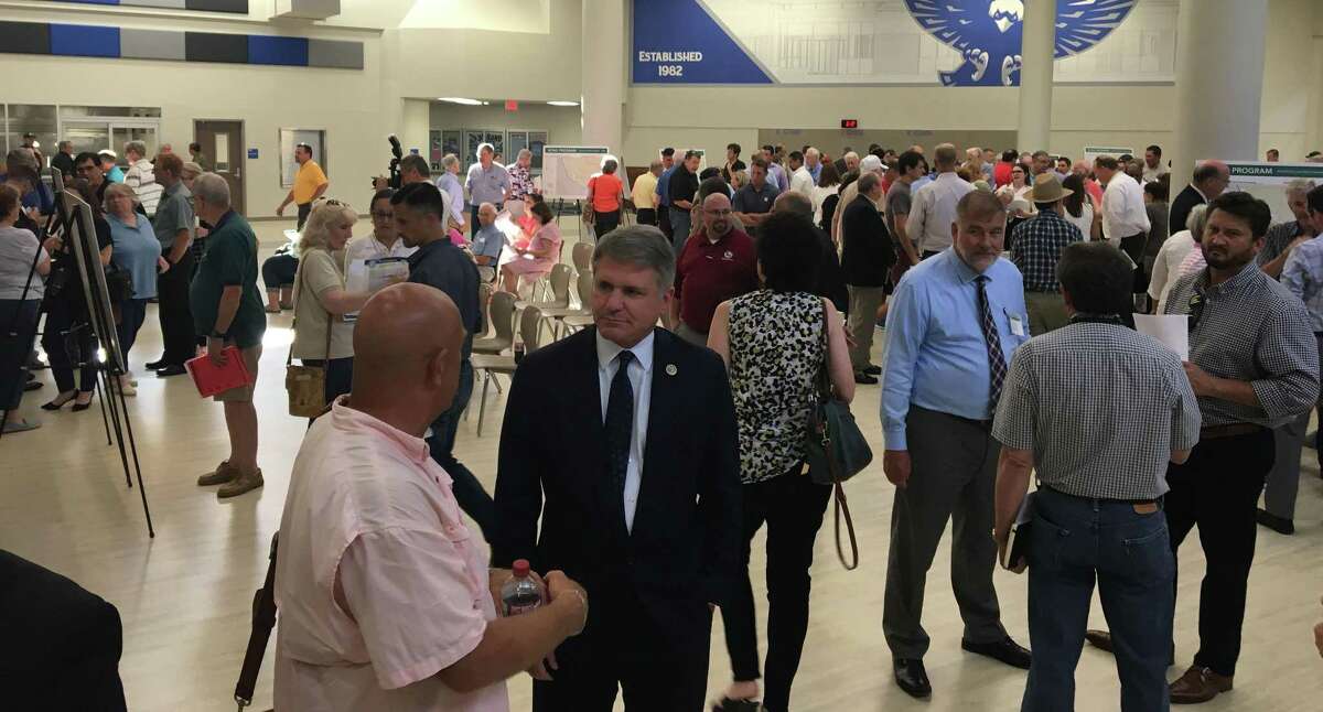Among elected officials attending the Aug. 1 meeting of the Harris County Flood Control District was 10th District U.S. Rep. Michael McCaul, center.