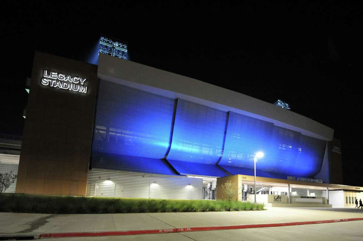Legacy Stadium is painted in blue light to recognize the Katy Taylor Mustangs as the home team for a football scrimmage on Thursday, Aug. 24.