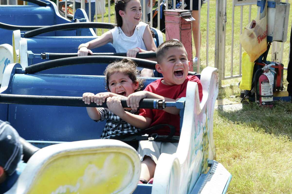 The Katy Rice Festival Oct. 12-14 will include carnival rides. These youngsters enjoyed the carnival at the 2015 Katy Rice Harvest Festival.