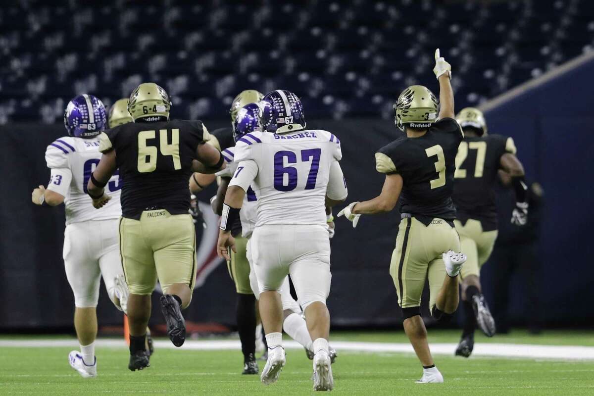 Foster Falcons Christian "chippy" Barillas (3) celebrates as cornerback Stephon West (16) returns a fumble for a touchdown in the first half during the high school football playoff game between the Foster Falcons and the Angleton Wildcats at NRG Stadium in Houston, TX on Friday, December 8, 2017.