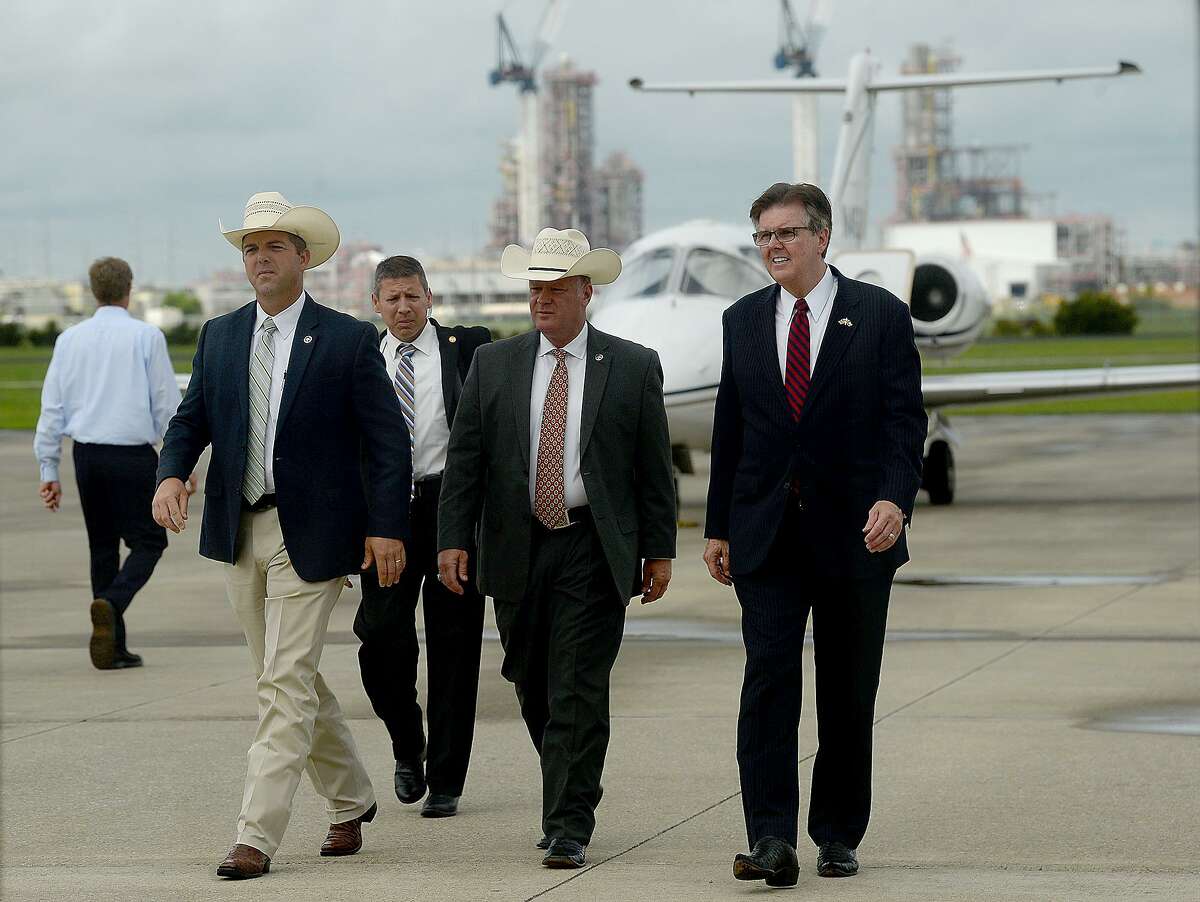 Lt. Governor Daniel Patrick talks with Texas Rangers Ryan Clendennen (far left) and Brandon Bess as he makes his way into the main gate during his stop at the Beaumont Municipal Airport Tuesday. Patrick later addressed issues including school security, education and job growth during his visit, which was one of several city stops in the region as he and Governor Greg Abbott campaign for re-election. Tuesday, September 04, 2018 Kim Brent/The Enterprise