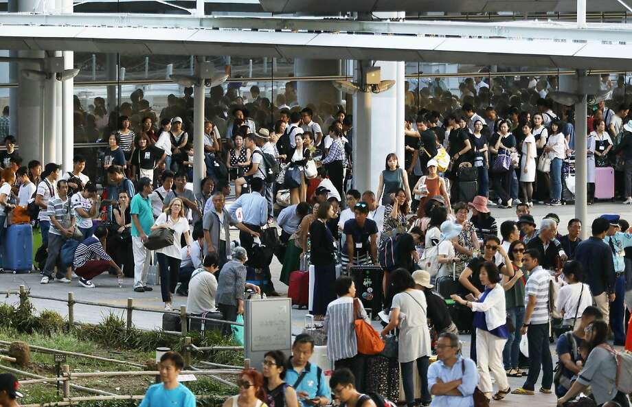 Thousands of passengers were stranded at the Kansai International Airport after the strongest typhoon that hit Japan in 25 years flooded a runway. Photo: Jiji Press / AFP / Getty Images