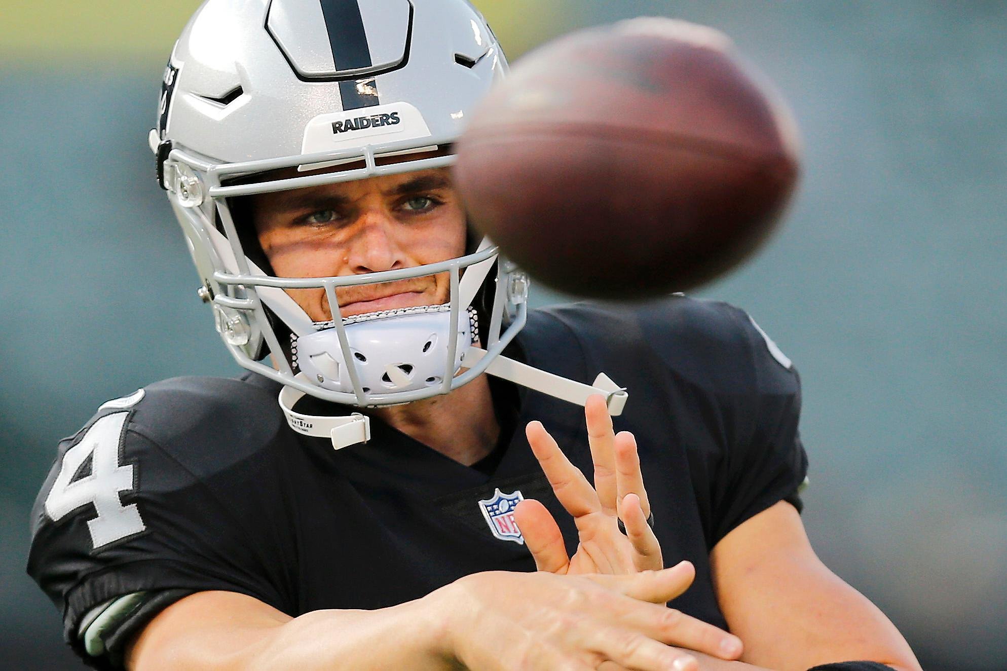 Oakland Raiders quarterback Derek Carr (4) during warms up drills