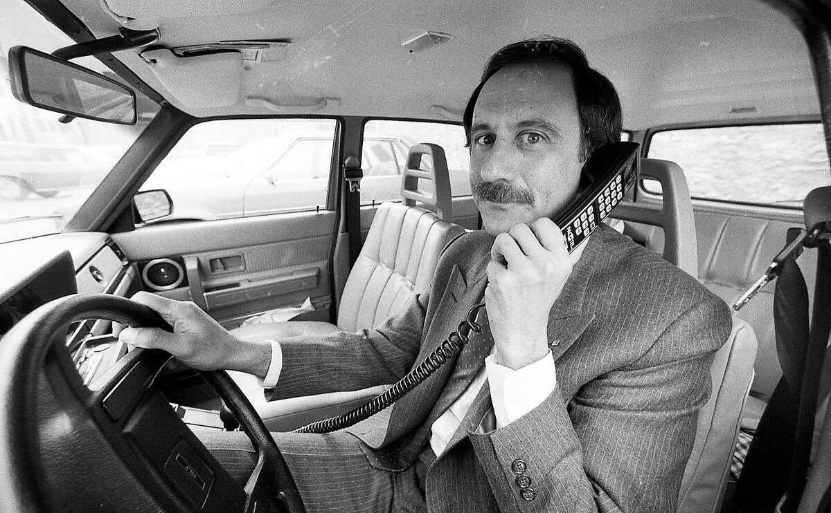 Nov. 14, 1984: Al Feinman with PacTel Mobile Services displays a new cellular phone. The cellular network was turned on in the Bay Area in 1985.