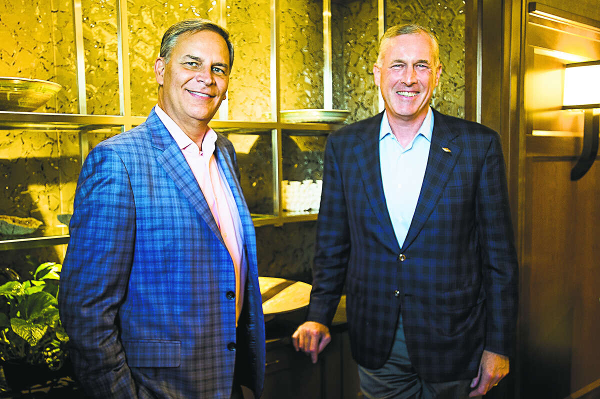 Dow CEO-elect Jim Fitterling, right, and President and CEO of the National Association of Manufacturers Jay Timmons, left, pose for a portrait on Tuesday at the Midland Country Club. (Katy Kildee/kkildee@mdn.net)