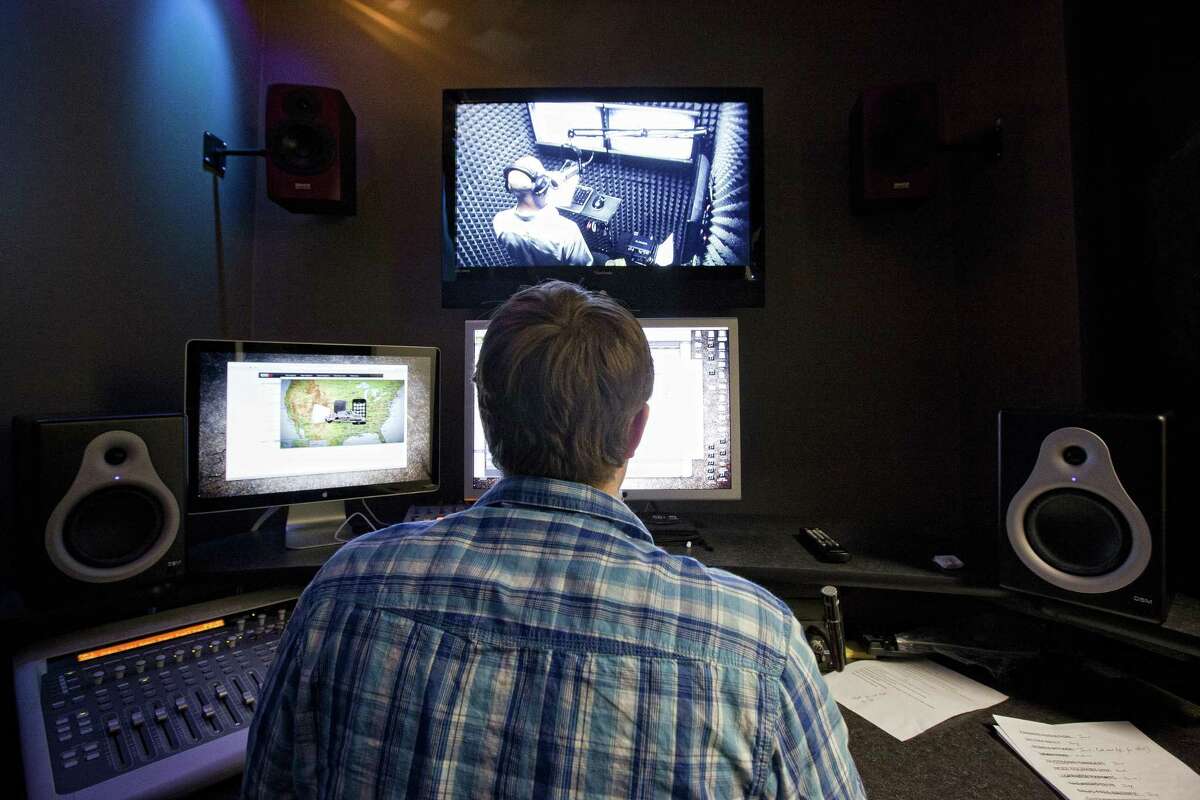 "Newsfix" sound designer Craig Anderson, monitors narrator Grego Onofrio as he records a news spot.