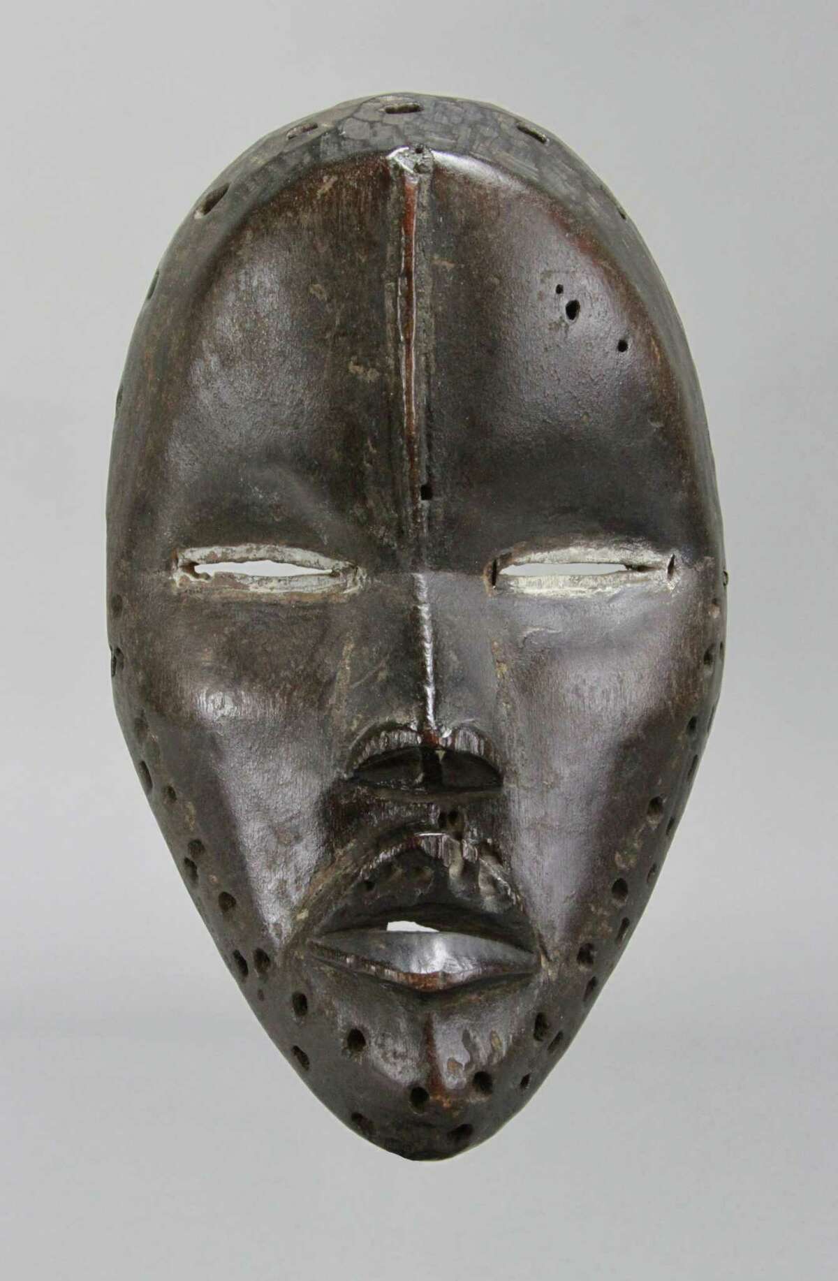 This Deangle mask of the Dan, or Gio, people of Liberia will be among the pieces on display in "Liberia, 1931-33: The Collections of Alfred J. Tulk," a show opening September 14, 2018, at the Fairfield University Art Museum. The show teams objects collected by the late artist during a visit to the African nation during the early 1930s, as well as his artwork. A longtime Fairfield and New Haven counties resident, Tulk died in 1988. Private collection. FIG 1: Mask (Deangle). Dan/Gio, Liberia. Wood, kaolin. 8 inches. Private collection.