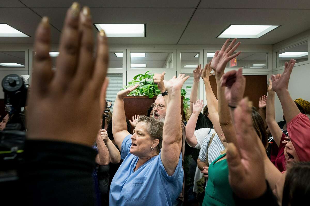 Protesters shout inside Senate Judiciary Committee Chairman Chuck Grassley�s office, before the third day of Judge Brett Kavanaugh's confirmation hearing for the U.S. Supreme Court began on Capitol Hill, in Washington, Sept. 6, 2018. (Erin Schaff/The New York Times)