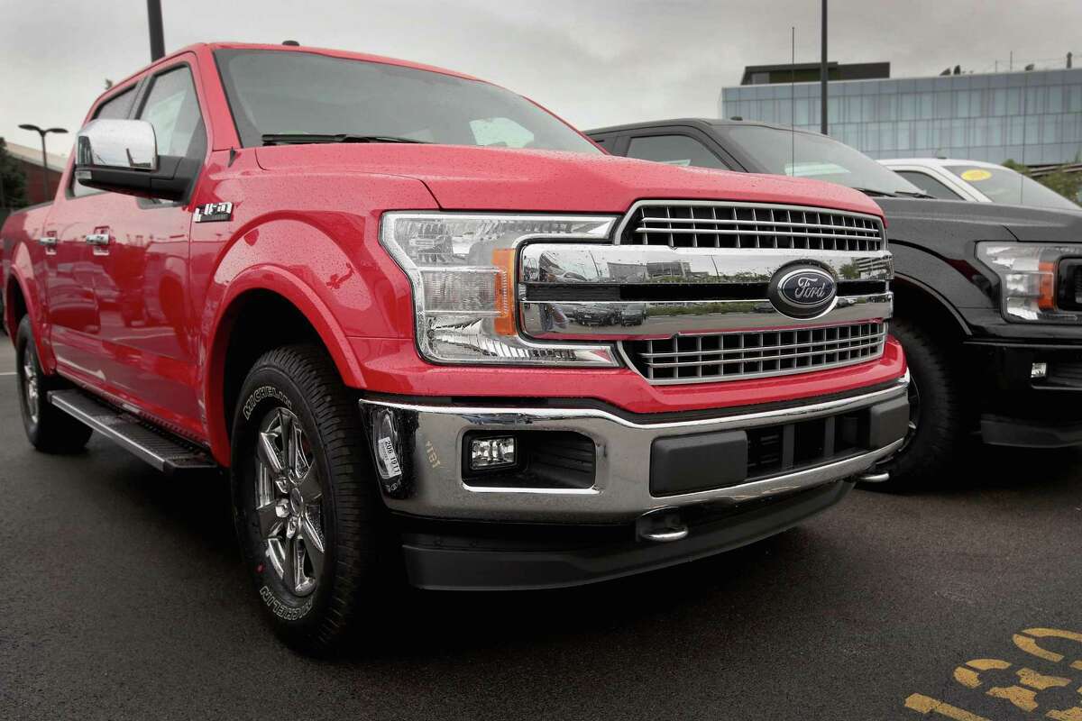 Ford F-150 pickup trucks are offered for sale at a dealership on September 6, 2018 in Chicago, Illinois. Ford has announced a recall of about 2 million of the trucks because of a seatbelt problem that could result in a fire.