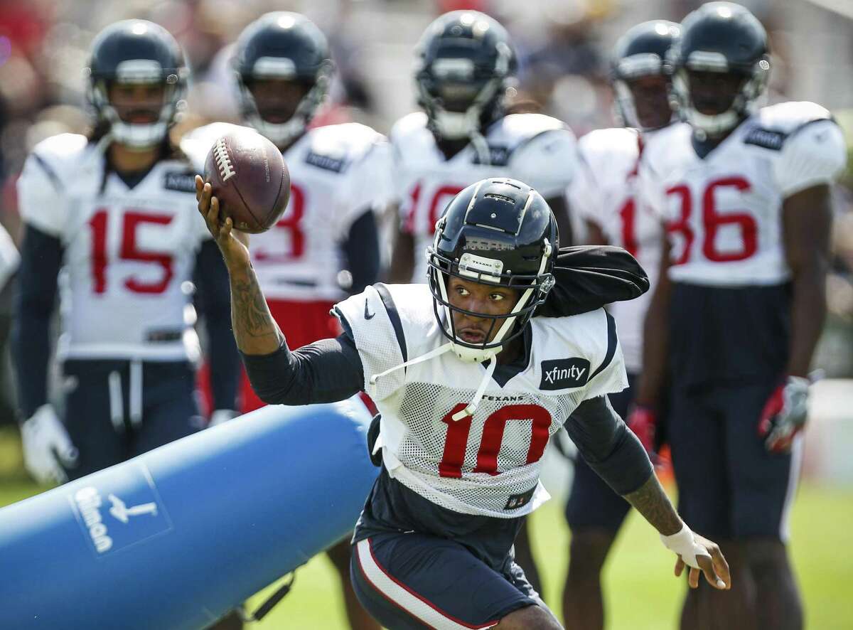 Houston Texans wide receiver DeAndre Hopkins (10) reaches out to make a one-handed catch during training camp at the Greenbrier Sports Performance Center on Saturday, Aug. 4, 2018, in White Sulphur Springs, W.Va.