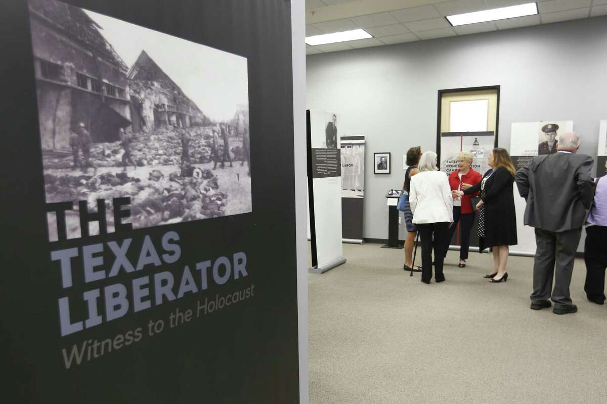 Visitors walk through the exhibit: The Texas Liberator, Witness to the Holocaust, at Holocaust Museum Houston on Thursday, Sept. 6, 2018, in Houston. The exhibit honors American soldiers from Texas who helped liberate the concentration camps of Europe at the end of the World War II.