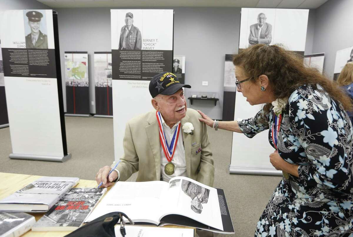 Birney "Chick" Havey, Jr., a former American soldier during World War II, talks to Jamie Josephs while visiting The Texas Liberator, Witness to the Holocaust, exhibit at the Holocaust Museum Houston on Thursday, Sept. 6, 2018, in Houston. The exhibit honors American soldiers from Texas who helped liberate the concentration camps of Europe at the end of the war. Havey and Josephs' father, Herman "Hank" Josephs, helped liberate concentration camp prisoners at the wne of the war.
