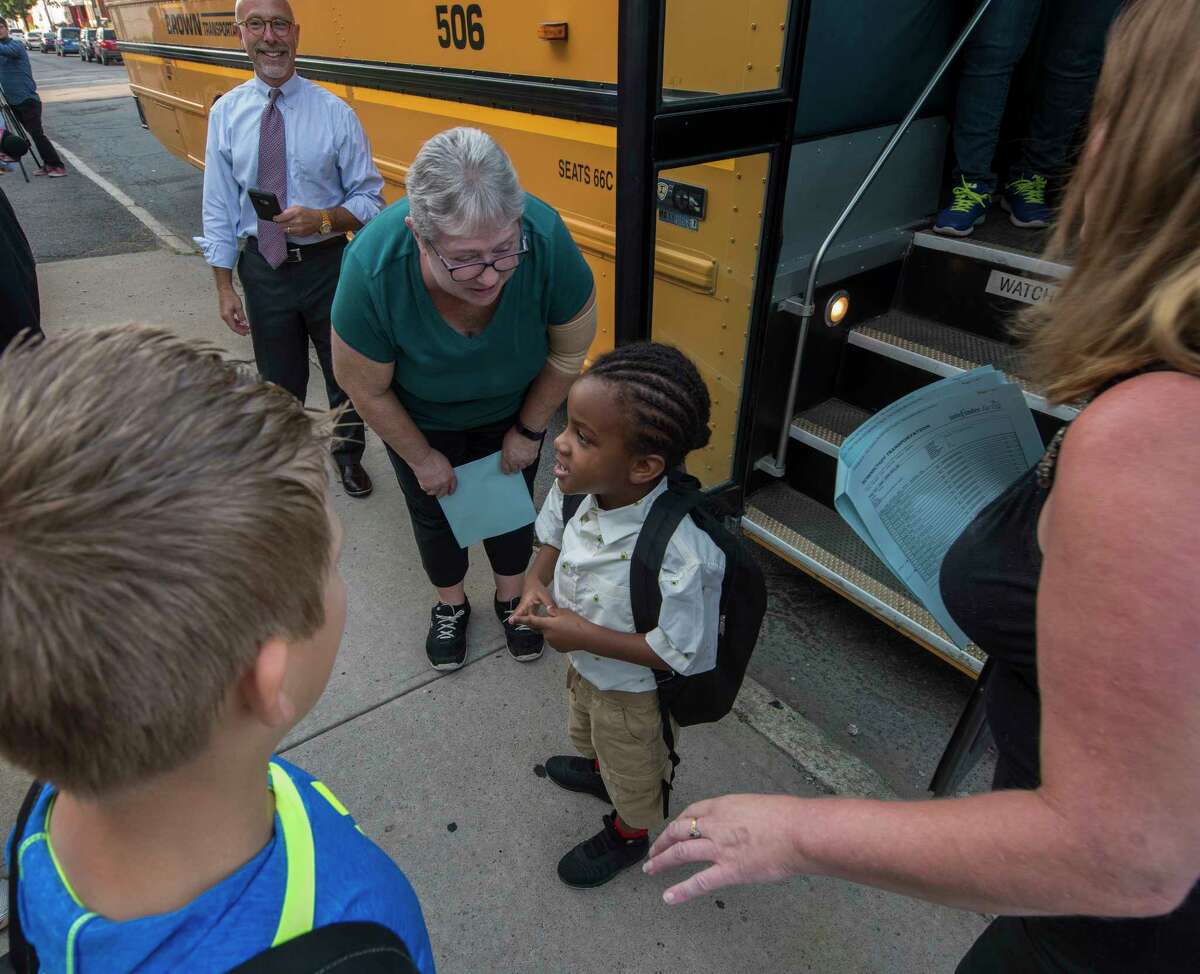 Take a look through the slideshow above of photos of first days of school in past years by Times Union photographers.  Pre-K student Jacob Taylor, 5, gets assistance getting to class on opening day at the Hamilton Elementary School Sept. 6, 2018 in Schenectady, N.Y. (Skip Dickstein/Times Union)