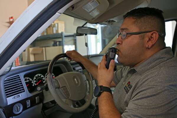 Smart Start assistant manager Omar Hernandez blows into the ignition interlock system to make sure the device works properly.