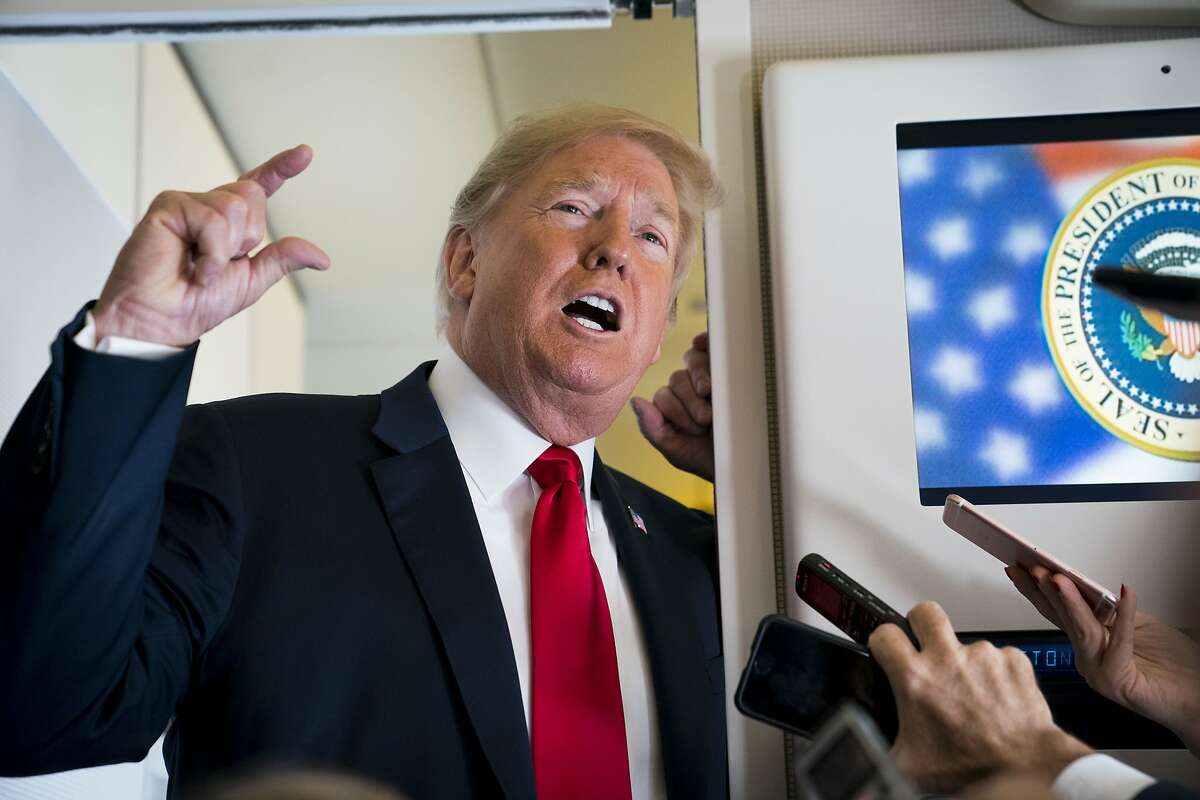 President Donald Trump talks to reporters aboard Air Force One while headed to North Dakota, Sept. 7, 2018. Trump said on Friday that he wants Attorney General Jeff Sessions to investigate the source of an anonymous Op-Ed piece published in The New York Times, intensifying his attack on an article that he has characterized as an act of treason. (Doug Mills/The New York Times)