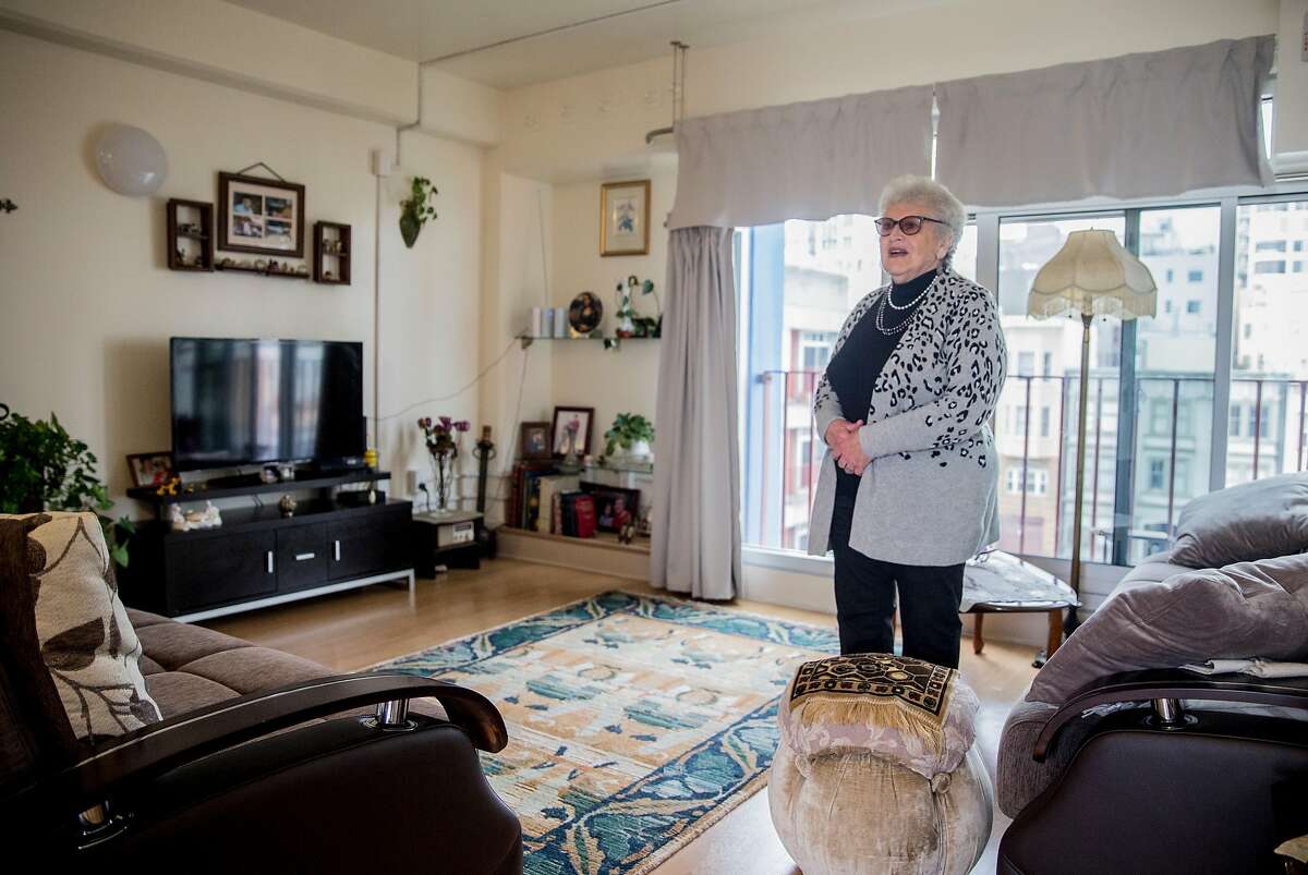Chinatown Community Development Center's Community Tenants Association Vice President Susanna Sandler stands in the living room of her one bedroom unit at 990 Pacific Avenue, an affordable housing community in the Chinatown neighborhood of San Francisco, Calif. Thursday, Sept. 6, 2018.