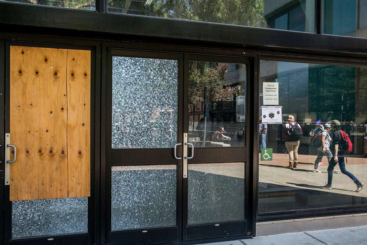 A wooden board covers a broken glass door on the old gymnasium on campus at Laney College in Oakland in 2018. The Peralta Community College District’s board has approved a new security arrangement that replaces armed sheriff’s deputies.